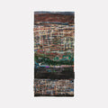 The artwork 'Entangled Verse' by Christopher Blyth features layered abstract patterns in encaustic and mixed media, creating a textured landscape of intersecting lines and grids. Rich earth tones of rust and brown blend with deep greens and blacks, while sporadic touches of blue add depth. The vertical composition showcases complex collage elements and weathered textures.