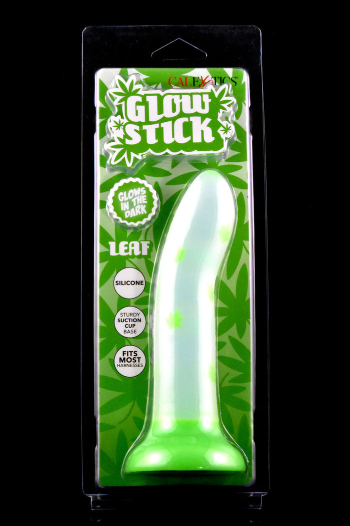 Glow Stick silicone dildo with leaf pattern in green retail box, glow-in-the-dark design and suction-cup base featured.