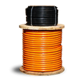 UNIMIG MEGAFLEX welding cable shown as orange cable on a wooden reel with a black coil above